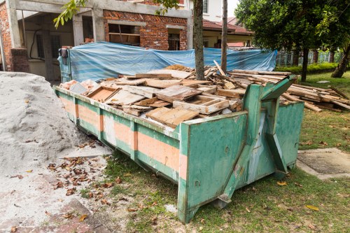 Waste removal truck in Beaconsfield with community backdrop