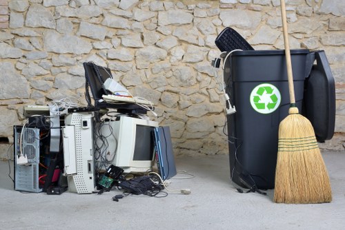 Worker using protective equipment while handling commercial waste